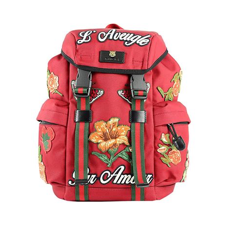 red and black Gucci backpack